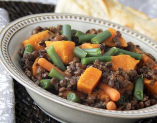 a close up of a bowl of curried sweet potato and lentil stew