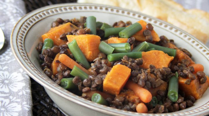 a close up of a bowl of curried sweet potato and lentil stew