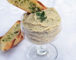 a close up of a cup of lima bean spread