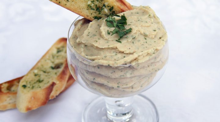 a close up of a cup of lima bean spread