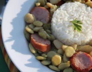 a plate of green baby lima beans and rice