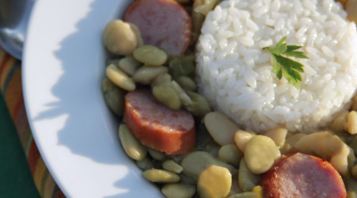 a plate of green baby lima beans and rice