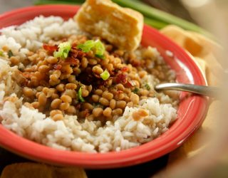 a close up of a plate full of lady cream peas and rice