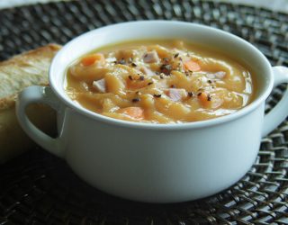 a close up of a bowl of sawyers yellow split pea soup