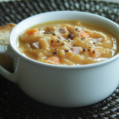 a close up of a bowl of sawyers yellow split pea soup