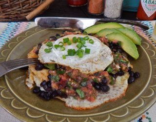 a close up of a plate of Huevos Rancheros