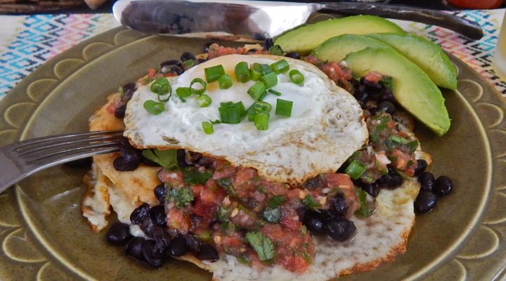 a close up of a plate of Huevos Rancheros