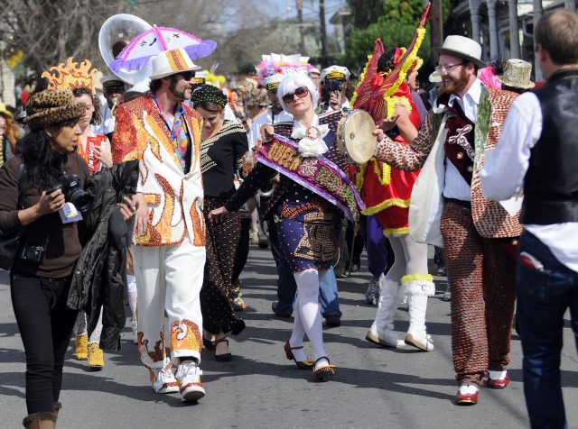 Devin Meyers leads the Red Beans Parade on Lundi Gras