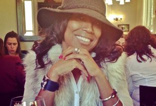 close up of Monica Mingo wearing a hat