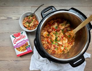 InstaPot of Jambalaya with Camellia Brand's Jambalaya Seasoning Mix next to it