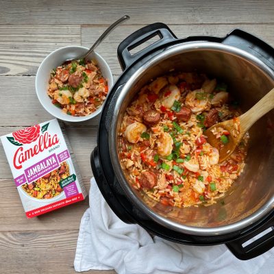 InstaPot of Jambalaya with Camellia Brand's Jambalaya Seasoning Mix next to it