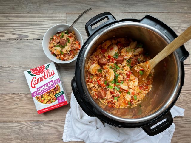 InstaPot of Jambalaya with Camellia Brand's Jambalaya Seasoning Mix next to it