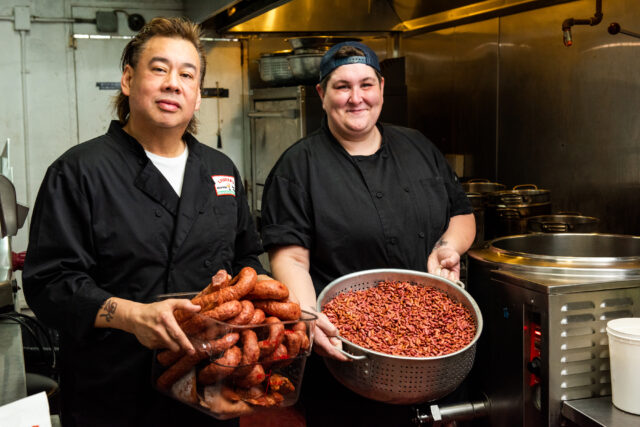 Liuzza’s on Bienville - Chef's holding a large pot of red beans and sausages