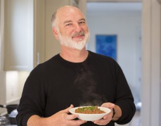 photo of Pableaux Johnson holding a dish, courtesy of PeachDish.com