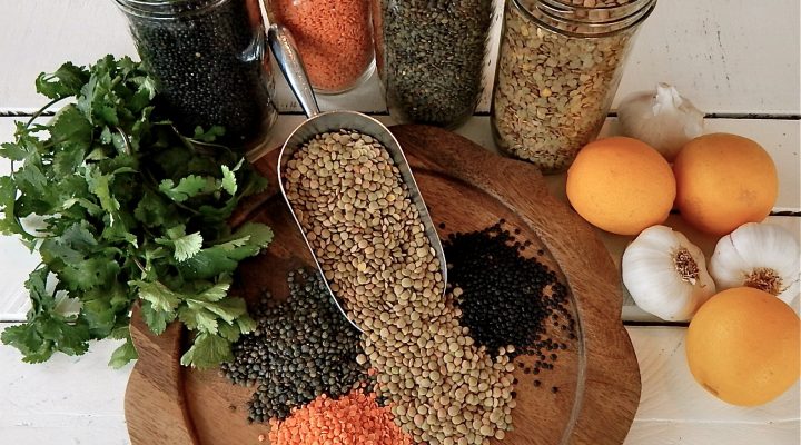 Various Types of Lentils Spill out on a cut board