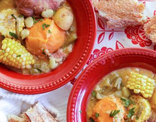 2 red bowls of caldo with camellia navy beans