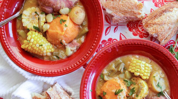 2 red bowls of caldo with camellia navy beans