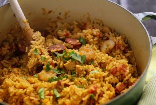 a dutch oven full of red Creole Jambalaya