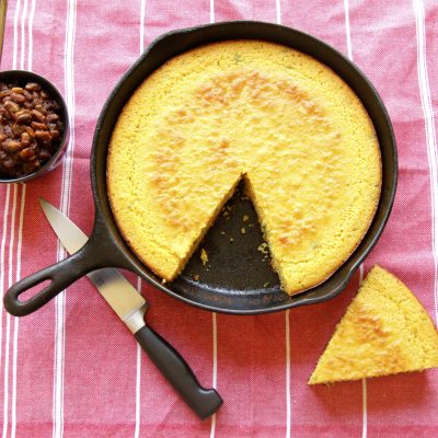 a cast iron skillet full of corn bread