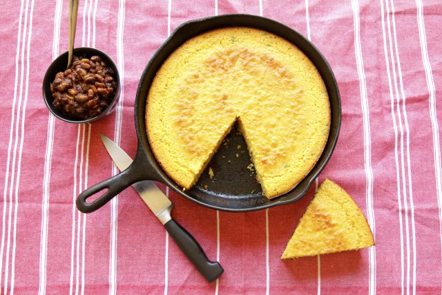 a cast iron skillet full of corn bread