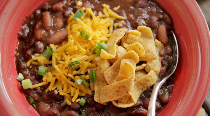 a close up of a bowl of 3 bean vegetarian chili