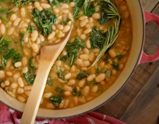 a dutch oven full of White Bean and Spinach Soup