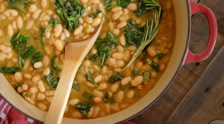 a dutch oven full of White Bean and Spinach Soup