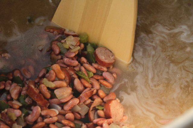 Water and seasonings are added to the pot