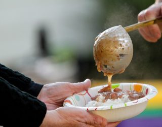 serving red beans and rice at a festival