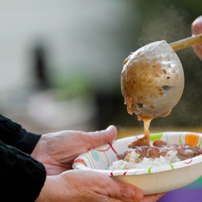 serving red beans and rice at a festival