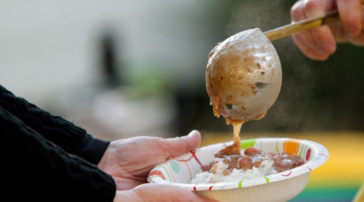 serving red beans and rice at a festival