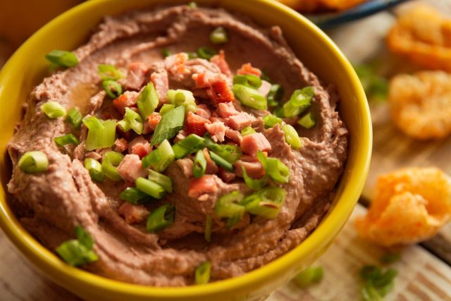 Cajun Hummus in a Bowl with Pork Rinds