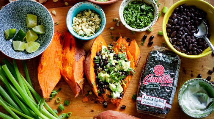 Black Bean Stuffed Sweet Potatoes featuring a bag of camellia brand black beans and various herbs and spices