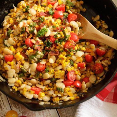 a cast iron pot full of southern summer succotash