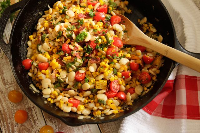 a cast iron pot full of southern summer succotash