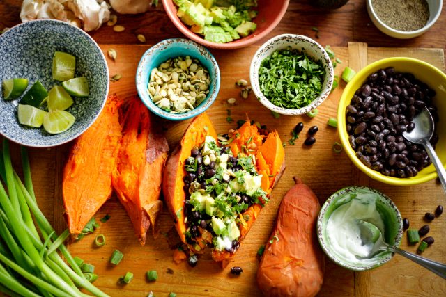 Black Bean Stuffed Sweet Potatoes featuring a bag of camellia brand black beans and various herbs and spices