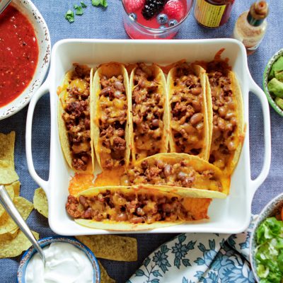 7 oven baked beef and pinto bean tacos in an oven pan