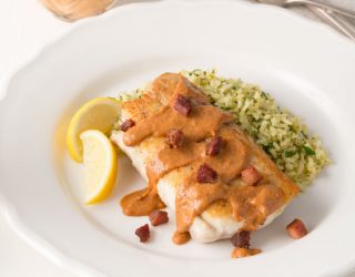 a plate of pan seared snapper with creole red bean sauce