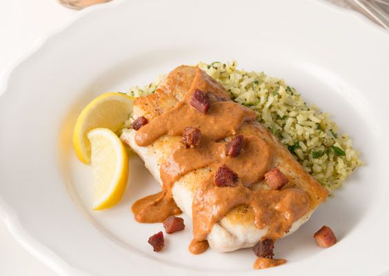 a plate of pan seared snapper with creole red bean sauce