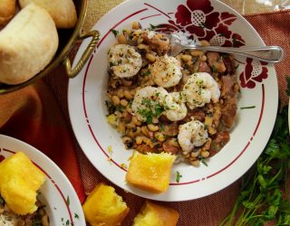 a palte of garlicky shrimp and blackeye peas