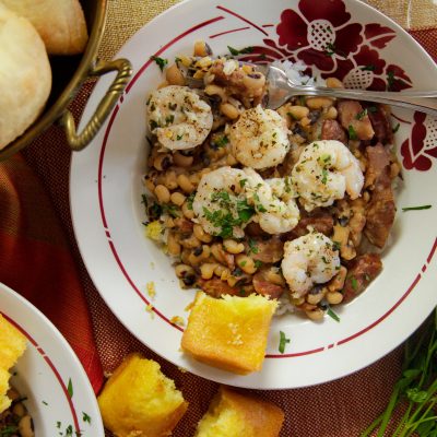 a palte of garlicky shrimp and blackeye peas