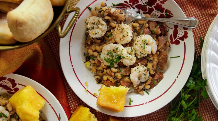 a palte of garlicky shrimp and blackeye peas