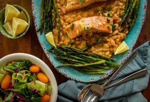 a big plate of roasted salmon white beans preserved with lemons