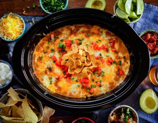 game day camellia bean dip in a crock pot featuring corn chips