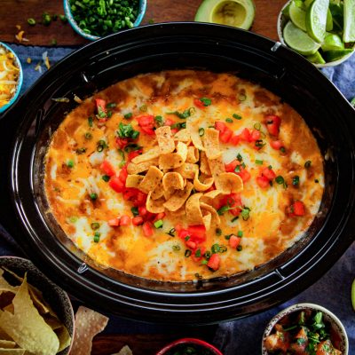 game day camellia bean dip in a crock pot featuring corn chips