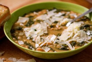 a bowl of white bean spinach soup