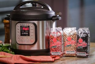 instant pot saying hot next to a bag of camellia red kidneys, pinto, and black beans
