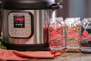 an insta pot next to 2 packages of red beans