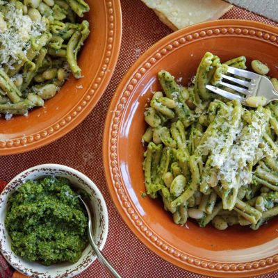 a bowl of white bean pesto pasta