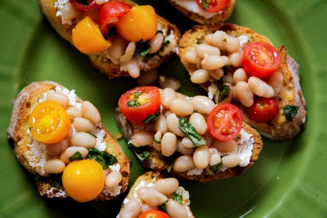 plate of tomato white bean bruschetta